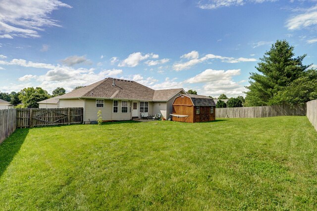 608 S Ashwood Ct, Nixa, MO 65714 - rear view of property with a storage unit and a fenced backyard