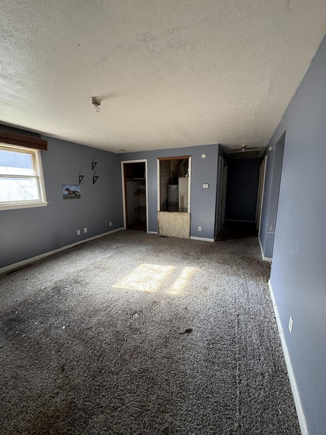 1657 N Hayes Ave, Springfield, MO 65803 - unfurnished room with a textured ceiling and carpet flooring