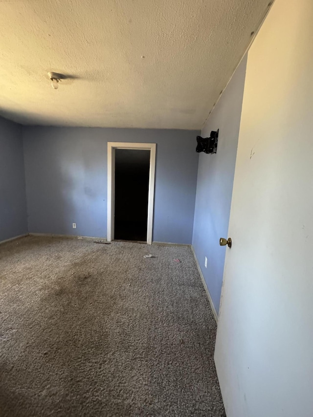 1657 N Hayes Ave, Springfield, MO 65803 - carpeted empty room with a textured ceiling