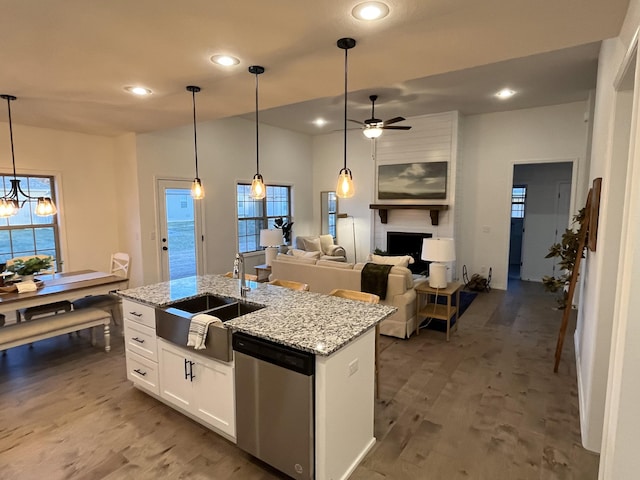 921 S Deerfield Ct, Nixa, MO 65714 - kitchen featuring dishwasher, ceiling fan, recessed lighting, an island with sink, and white cabinetry