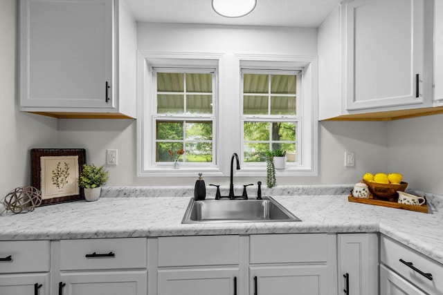 1024 N Fulbright Ave, Springfield, MO 65802 - kitchen featuring white cabinetry and light countertops