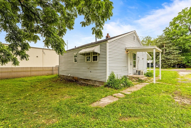 1024 N Fulbright Ave, Springfield, MO 65802 - view of side of property with a lawn and a chimney