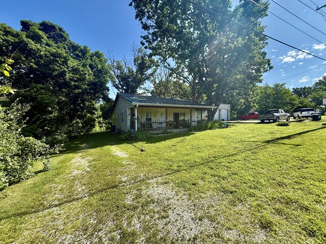1235 W State Route 17, Houston, MO 65483 - view of green lawn featuring a porch