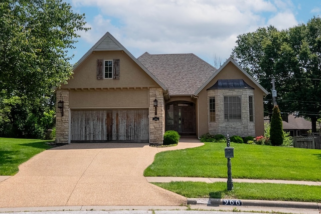 966 S Carriage Ave, Springfield, MO 65809 - view of front facade featuring stone siding, a front lawn, concrete driveway, a garage, and stucco siding
