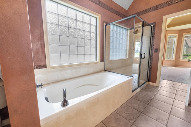 966 S Carriage Ave, Springfield, MO 65809 - bathroom featuring a bath, a shower stall, and tile patterned flooring