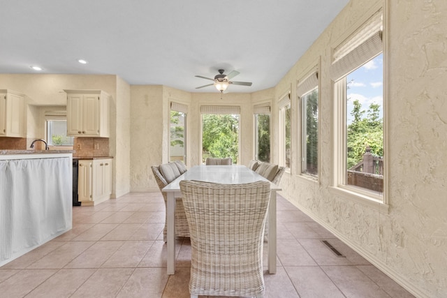 966 S Carriage Ave, Springfield, MO 65809 - sunroom featuring tile patterned floors, a textured wall, and recessed lighting