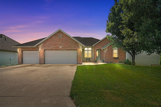 628 N Alexandria St, Nixa, MO 65714 - view of front of house featuring driveway, a yard, brick siding, an attached garage, and roof with shingles