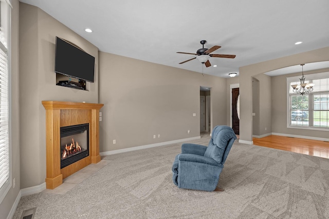 628 N Alexandria St, Nixa, MO 65714 - sitting room with carpet floors, a chandelier, a fireplace with flush hearth, ceiling fan, and recessed lighting