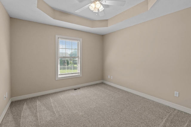 628 N Alexandria St, Nixa, MO 65714 - empty room featuring carpet flooring, ceiling fan, and a tray ceiling