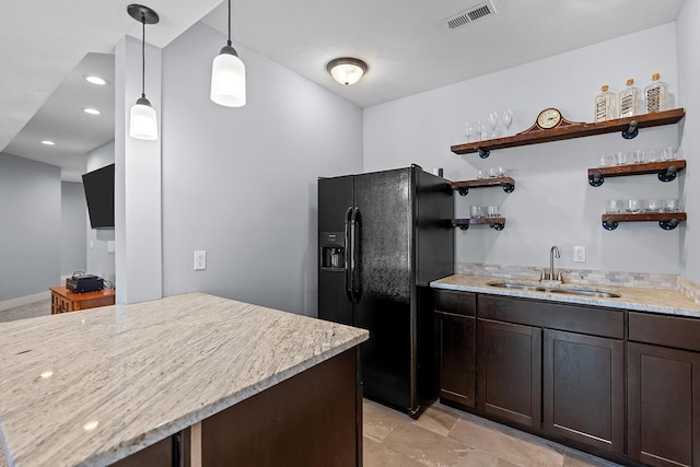 628 N Alexandria St, Nixa, MO 65714 - kitchen with open shelves, black refrigerator with ice dispenser, light stone counters, dark brown cabinetry, and recessed lighting