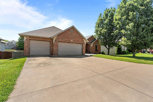 628 N Alexandria St, Nixa, MO 65714 - view of front of property with brick siding, concrete driveway, an attached garage, and a shingled roof