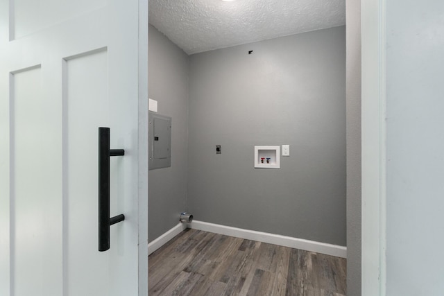 3512 S Ferguson Ave, Springfield, MO 65807 - laundry area featuring electric dryer hookup, electric panel, wood finished floors, washer hookup, and a textured ceiling