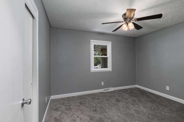 3512 S Ferguson Ave, Springfield, MO 65807 - spare room featuring a textured ceiling, a ceiling fan, and dark colored carpet
