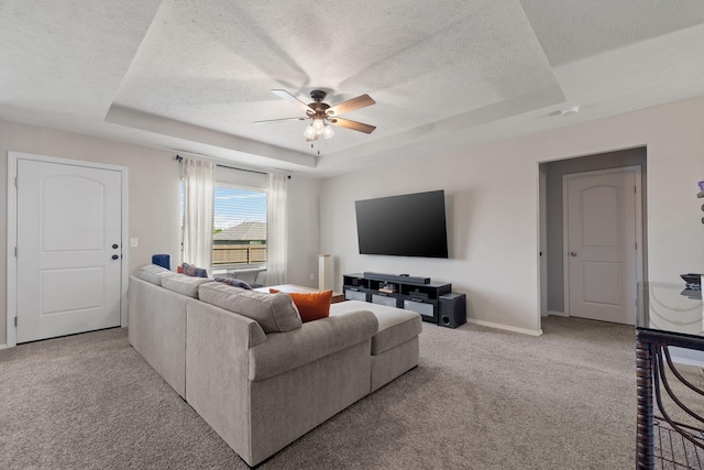 460 Hudson Ave, Republic, MO 65738 - carpeted living room with a raised ceiling, ceiling fan, and a textured ceiling
