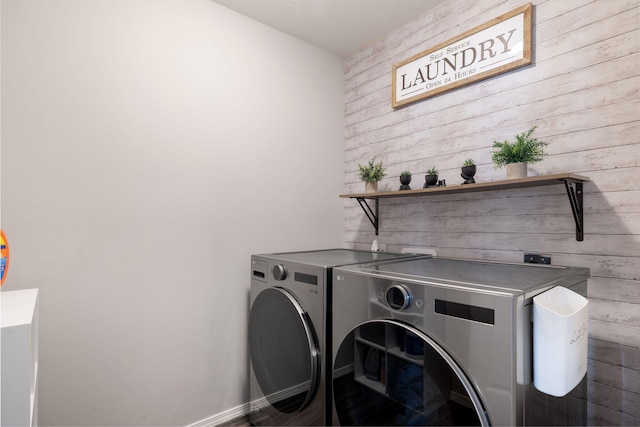460 Hudson Ave, Republic, MO 65738 - laundry room with washing machine and dryer and wooden walls
