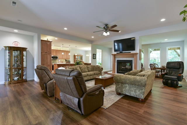 21791 Mill Creek Dr, Shell Knob, MO 65747 - living room with dark wood-style flooring, a glass covered fireplace, recessed lighting, and ceiling fan