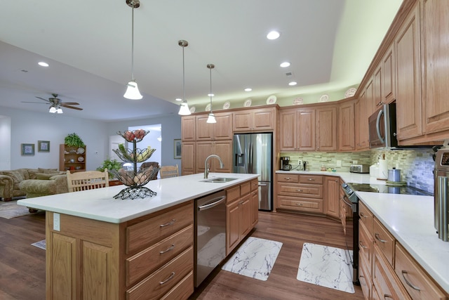 21791 Mill Creek Dr, Shell Knob, MO 65747 - kitchen featuring stainless steel appliances, open floor plan, light countertops, decorative backsplash, and a kitchen island with sink