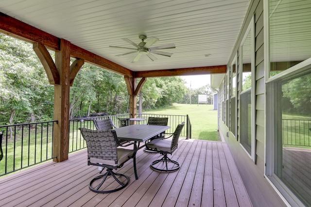 21791 Mill Creek Dr, Shell Knob, MO 65747 - wooden terrace featuring ceiling fan, outdoor dining space, and a lawn