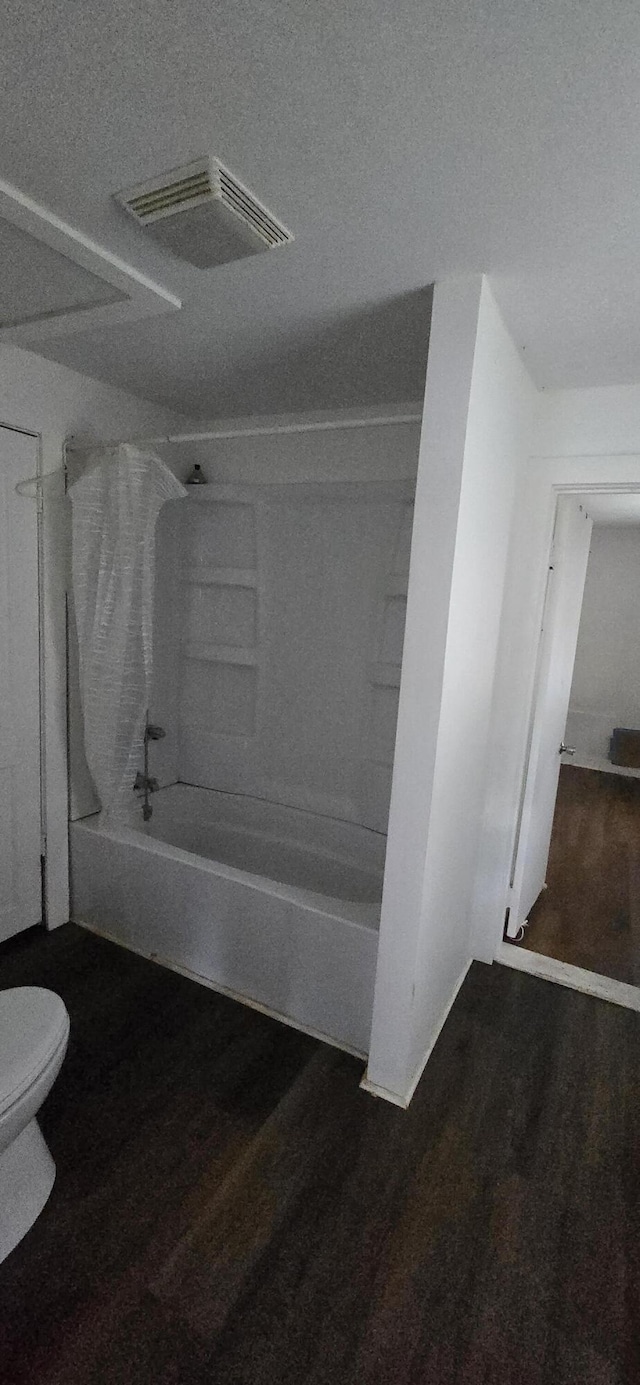 2351 E Pacific St, Springfield, MO 65803 - full bathroom featuring  shower combination and wood finished floors