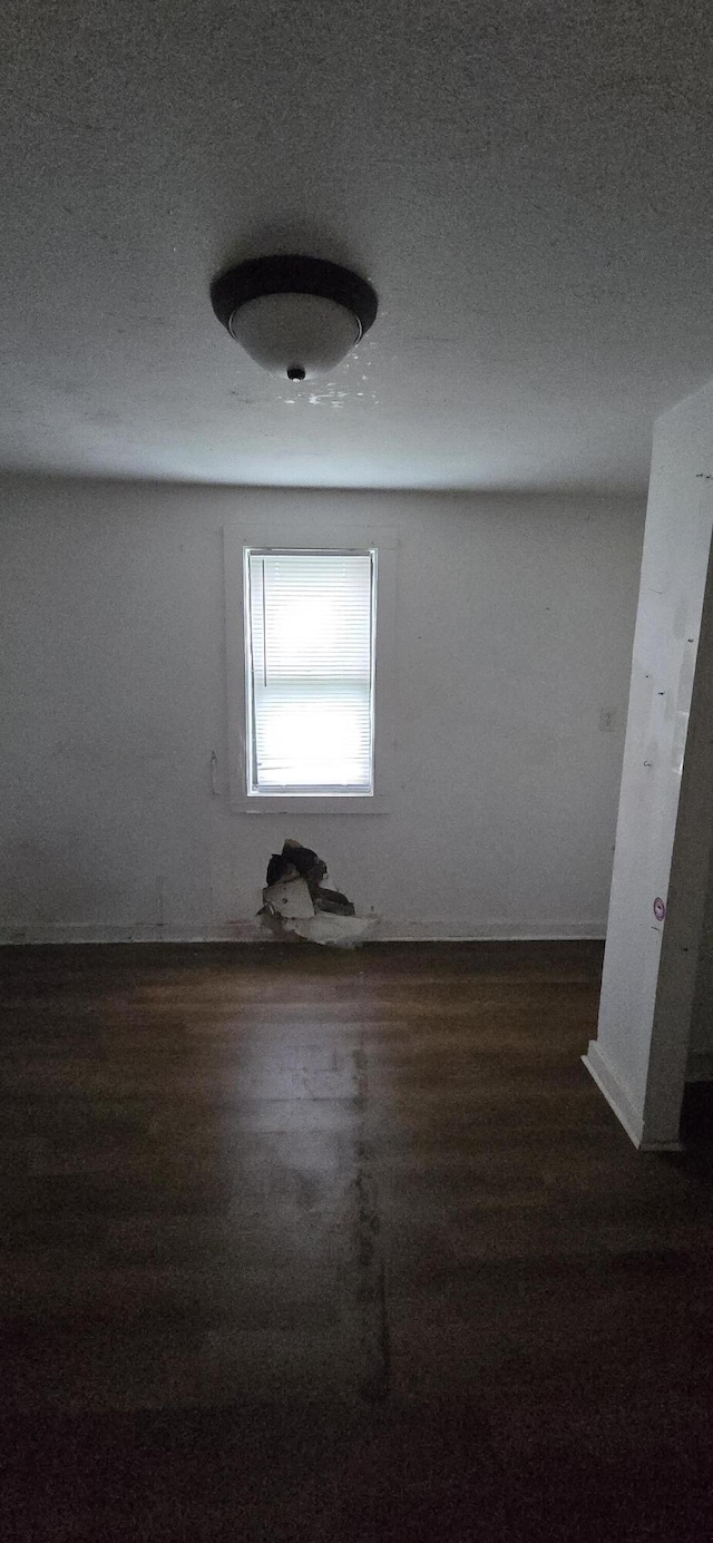 2351 E Pacific St, Springfield, MO 65803 - unfurnished room with wood finished floors and a textured ceiling