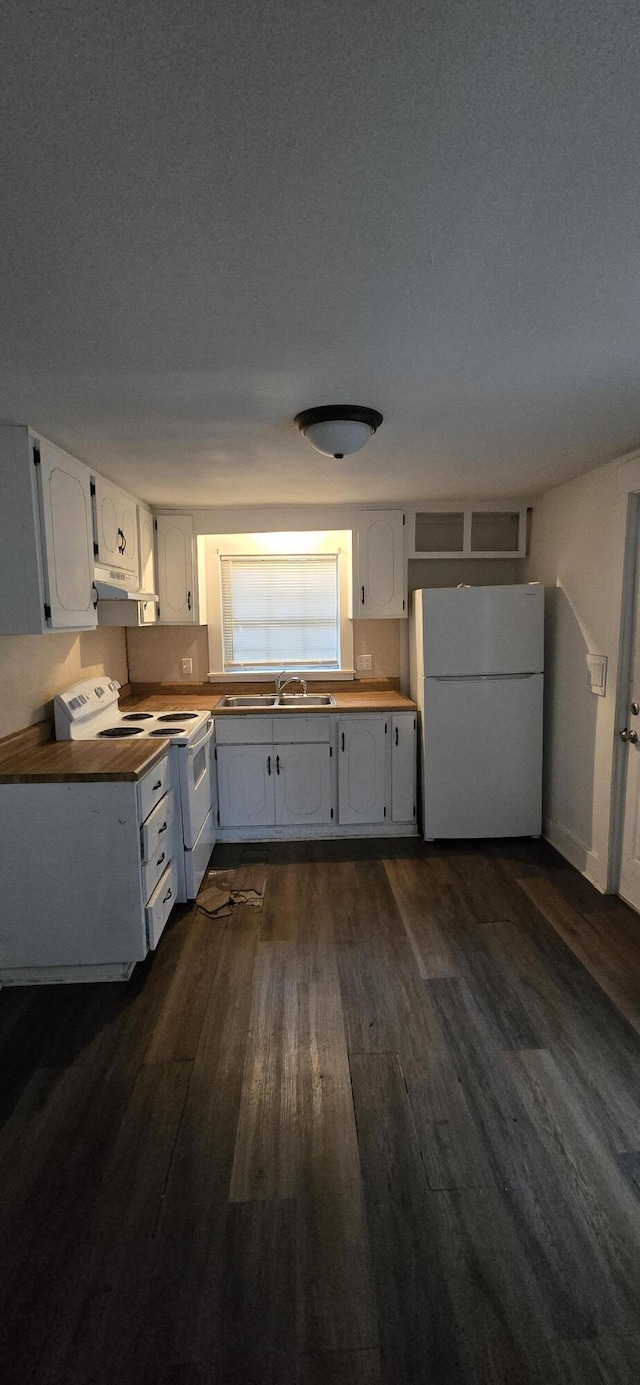 2351 E Pacific St, Springfield, MO 65803 - kitchen featuring white appliances, dark wood finished floors, white cabinets, wood counters, and under cabinet range hood