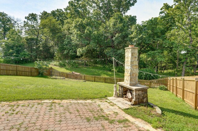 136 Cedar Dale Ln, Ozark, MO 65721 - fenced backyard featuring a patio area