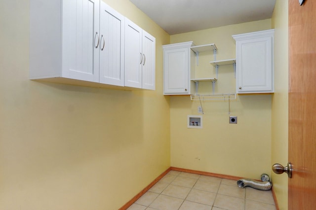 136 Cedar Dale Ln, Ozark, MO 65721 - washroom with hookup for an electric dryer, cabinet space, hookup for a washing machine, and light tile patterned floors