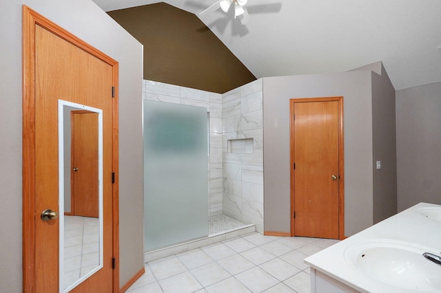 136 Cedar Dale Ln, Ozark, MO 65721 - full bathroom with vaulted ceiling, a tile shower, ceiling fan, double vanity, and tile patterned floors