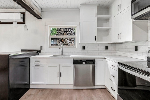 189 Walnut St, Sparta, MO 65753 - kitchen featuring stainless steel appliances, open shelves, light countertops, decorative backsplash, and white cabinetry