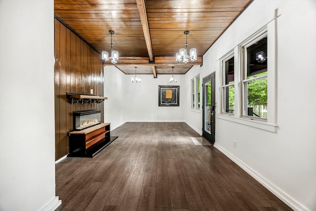 189 Walnut St, Sparta, MO 65753 - unfurnished living room with a chandelier, a wood ceiling with exposed beams, dark wood-style flooring, and a glass covered fireplace