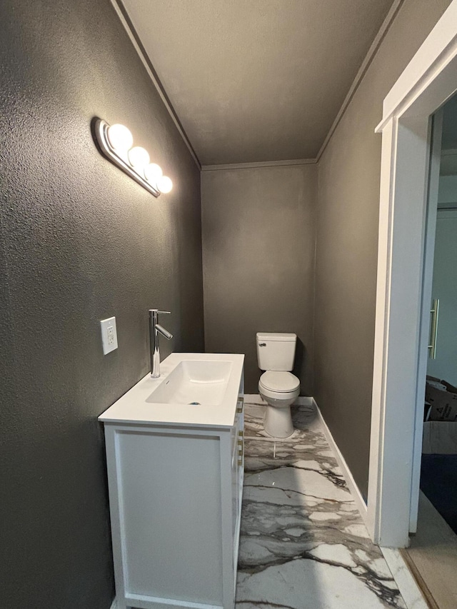 189 Walnut St, Sparta, MO 65753 - bathroom with marble finish flooring, vanity, a textured wall, and ornamental molding