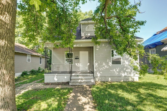 619 N Nettleton Ave, Springfield, MO 65802 - view of front of property with covered porch, a front lawn, and roof with shingles