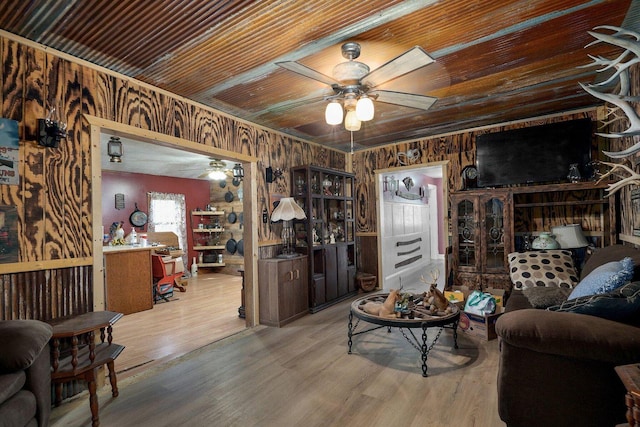 106 S Gilmore St, Miller, MO 65707 - living area featuring a ceiling fan, wood ceiling, wood walls, and wood finished floors