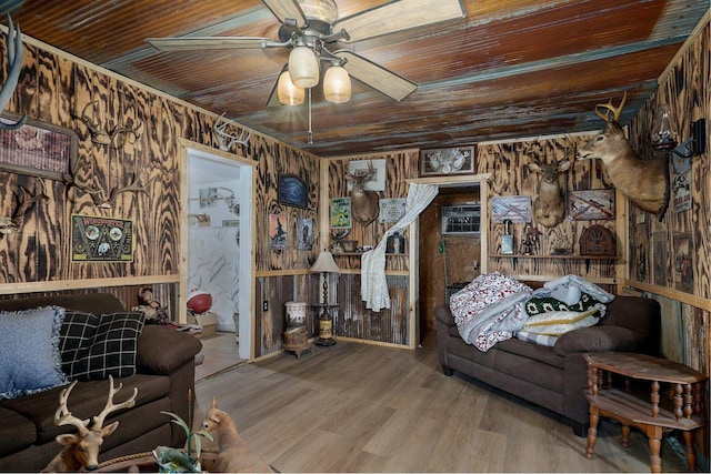 106 S Gilmore St, Miller, MO 65707 - living area featuring wood ceiling, a ceiling fan, wood walls, and wood finished floors