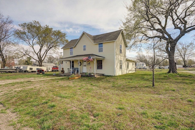 106 S Gilmore St, Miller, MO 65707 - view of front of property featuring covered porch, a front yard, and a shingled roof