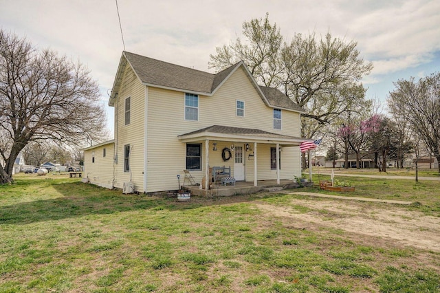 106 S Gilmore St, Miller, MO 65707 - view of front of property featuring a porch, a front lawn, and roof with shingles