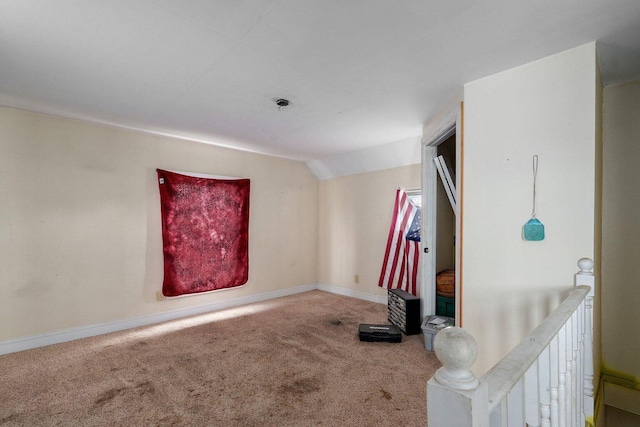 106 S Gilmore St, Miller, MO 65707 - carpeted empty room featuring baseboards and vaulted ceiling