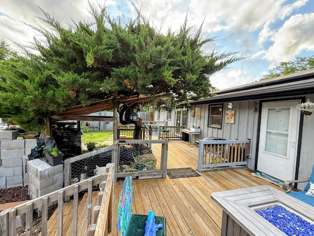 6424 W Farm Rd Unit 140, Springfield, MO 65802 - wooden terrace with an outdoor fire pit