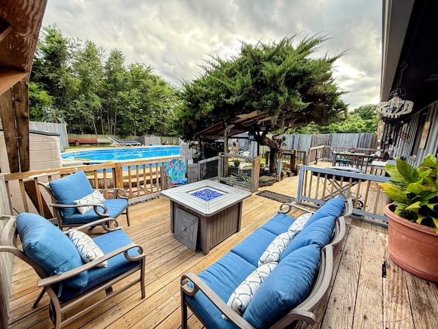 6424 W Farm Rd Unit 140, Springfield, MO 65802 - wooden deck with outdoor dining space and an outdoor living space with a fire pit