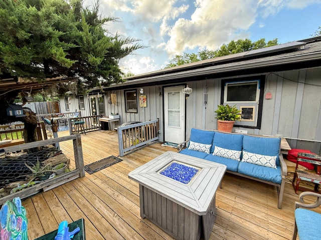 6424 W Farm Rd Unit 140, Springfield, MO 65802 - deck featuring an outdoor living space with a fire pit