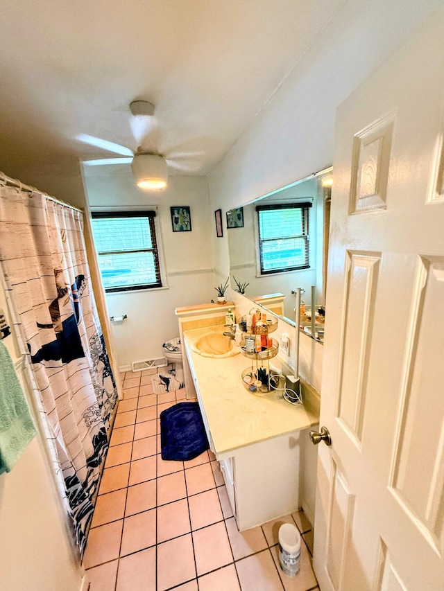 6424 W Farm Rd Unit 140, Springfield, MO 65802 - bathroom with tile patterned floors, vanity, healthy amount of natural light, and curtained shower