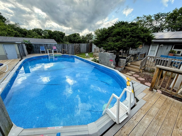 6424 W Farm Rd Unit 140, Springfield, MO 65802 - view of swimming pool featuring a deck and a fenced backyard