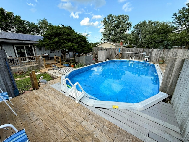 6424 W Farm Rd Unit 140, Springfield, MO 65802 - view of swimming pool featuring a deck and a fenced backyard
