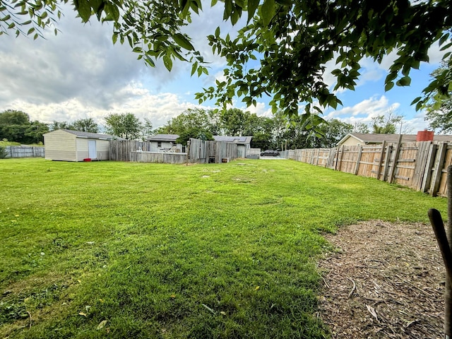 6424 W Farm Rd Unit 140, Springfield, MO 65802 - fenced backyard featuring a storage shed