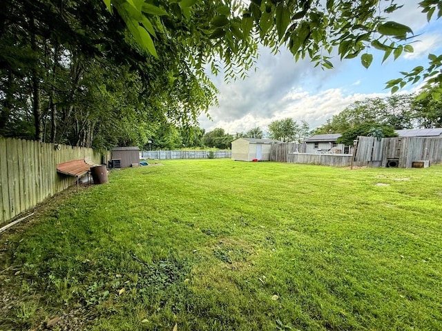 6424 W Farm Rd Unit 140, Springfield, MO 65802 - fenced backyard with a storage shed