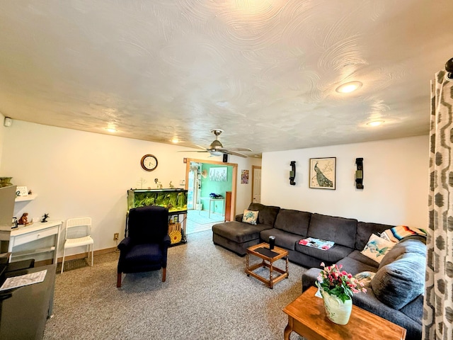 6424 W Farm Rd Unit 140, Springfield, MO 65802 - carpeted living room with ceiling fan and baseboards