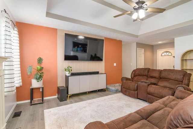 828 S Chinkapin Ave, Nixa, MO 65714 - living room with wood finished floors, a ceiling fan, and a raised ceiling