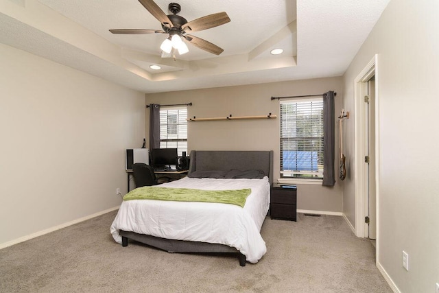 828 S Chinkapin Ave, Nixa, MO 65714 - bedroom featuring light carpet, multiple windows, a raised ceiling, and recessed lighting