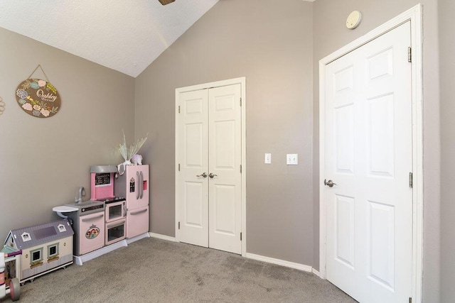 828 S Chinkapin Ave, Nixa, MO 65714 - rec room with vaulted ceiling and light colored carpet