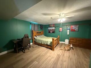 5125 S Walnut Hill Rd, Springfield, MO 65810 - bedroom with wood finished floors and a ceiling fan